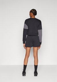Under Armour RIVAL SHORT - Sports shorts - black/white