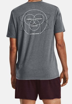 Gray short-sleeve t-shirt with circular graphic on back, featuring the words "Confidence," "Connection," and "Community" in white text.