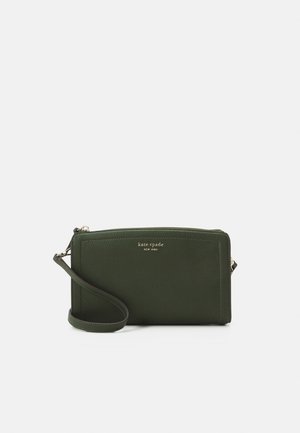 Dark green leather wristlet clutch with gold zipper and "kate spade new york" logo on front.