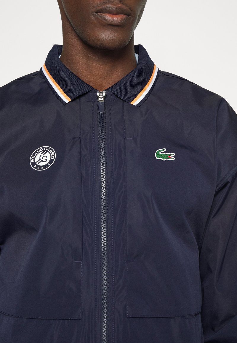 Herren Trainingsanzüge | Lacoste Sport TENNIS JACKET Trainingsjacke navy blue/white/mandarin tree orange/dunkelblau - OZ06247 Herren Trainingsanzüge | Lacoste Sport TENNIS JACKET Trainingsjacke navy blue/white/mandarin tree orange/dunkelblau - OZ06247