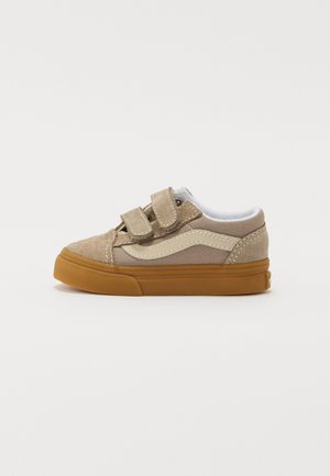 Beige suede shoes with double Velcro straps, white lining, and a rubber gum sole. Features a classic side stripe in a lighter shade.