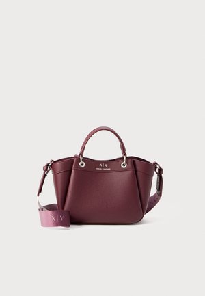 Wine-colored textured leather handbag with dual handles, detachable shoulder strap, and silver hardware. Logo printed on the front.