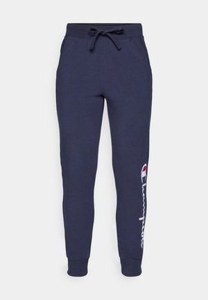 Marineblå sweatpants med snøre i taljen, elastiske manchetter og et hvidt Champion-logo design langs venstre ben. Blødt bomuldsblandingsmateriale.