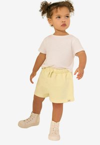 Next REGULAR FIT  - Pantalon de survêtement - yellow
