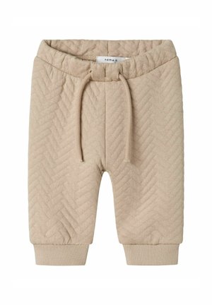 Beige gestrickte Shorts mit Fischgrätmuster, elastischem Bund mit Kordelzug und gerippten Bündchen am Saum. Weiche Textur.