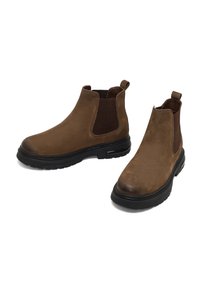 Stivali ankle in pelle marrone con pannelli laterali elastici, punta arrotondata e suola nera a contrasto. Presentano una parte superiore testurizzata e linguette per il sollevamento.