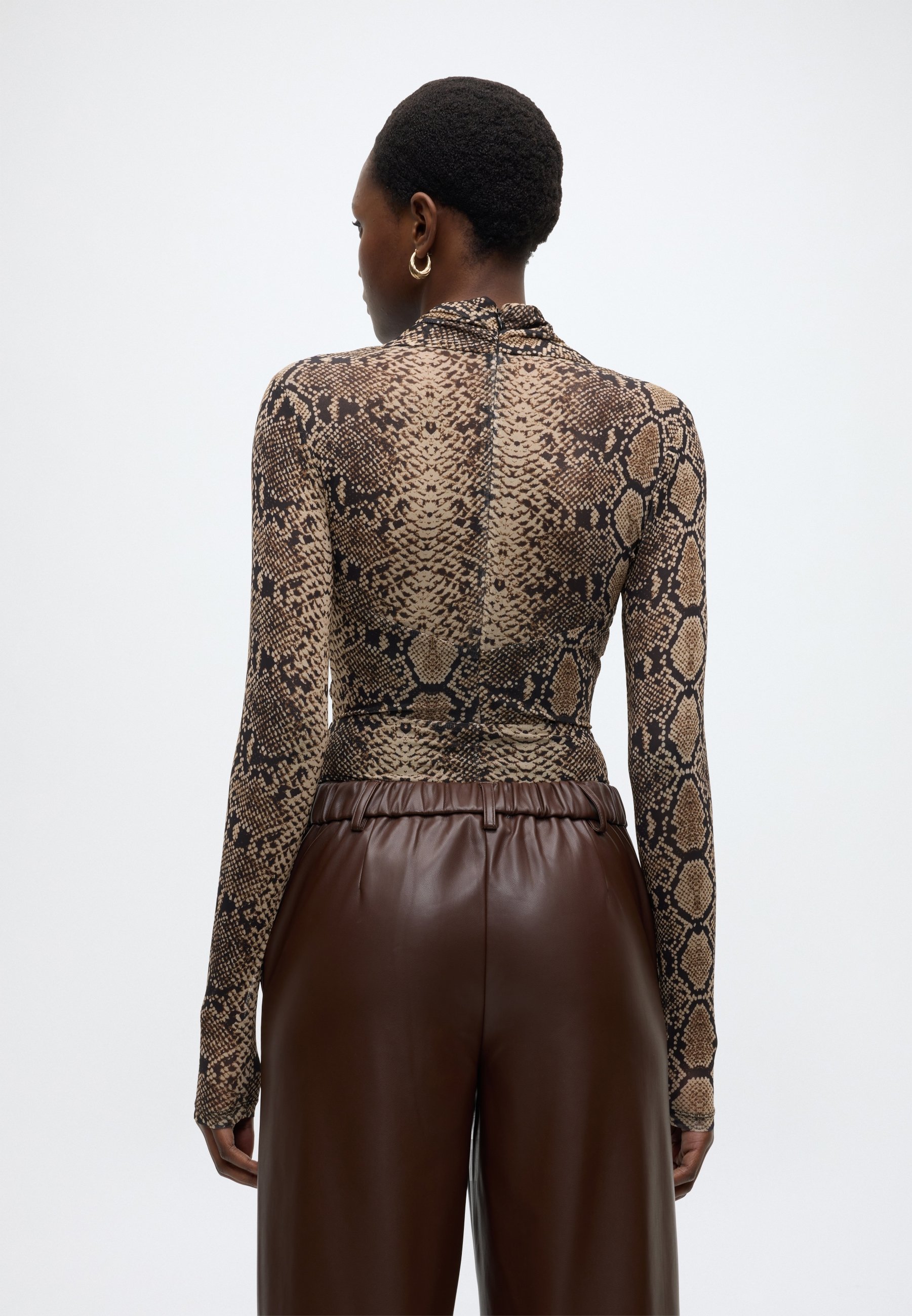 nike yellow snakeskin bodysuit