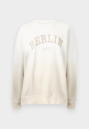 Sweatshirt crème avec dégradé. Présente "BERLIN" imprimé en beige clair en arc et un col et des poignets côtelés. Texture douce.