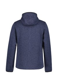 Mörkblå huva-jacka med texturerad tyg, rak skärning och långa ärmar. Har en enhetlig färg och subtilt mönstrad detalj.