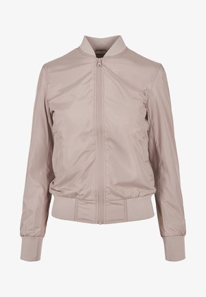 Light pink bomber jacket made of smooth nylon. Features a front zipper, ribbed cuffs, and a stand-up collar. Minimalist design with no patterns.