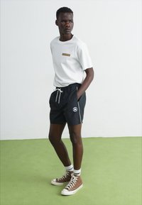 Converse RETRO CHUCK ELEVATED - Tréningruha alsók - black