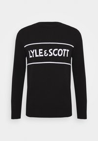 Pull noir à manches longues avec une bande horizontale blanche et le texte « LYLE & SCOTT » en lettres majuscules sur la poitrine.