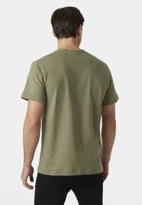 Helly Hansen CORE - Triko s potiskem - lav green