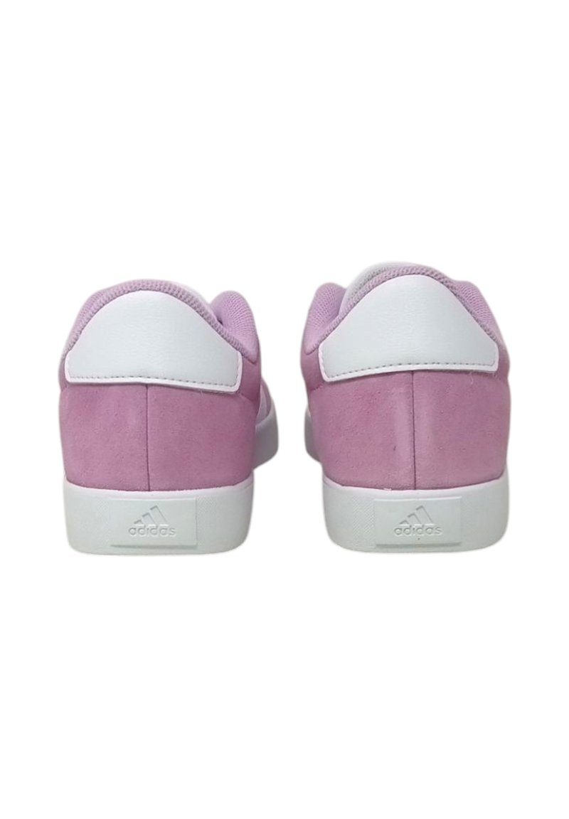 Pink suede sneakers with white accents. Low-top design, flat white sole, and padded collar. Features embossed logo on the heel.