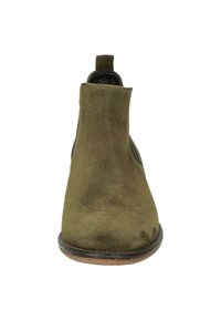 Bottine en suede vert avec un bout arrondi, design minimaliste et panneaux latéraux élastiques. Dispose d'une semelle en caoutchouc marron solide.