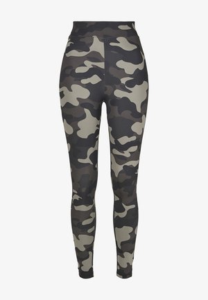 Kamo leggings i nyanser av svart, grått og beige. Høy midje med en jevn tekstur og tettsittende silhuett.