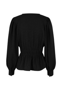 Black peplum blouse featuring long puff sleeves, textured fabric, and a smocked waistband for a fitted silhouette. Round neckline.