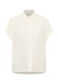 Short-sleeve, collared shirt in light cream fabric. Features a front button closure, straight cut hem, and subtle logo in matching color.