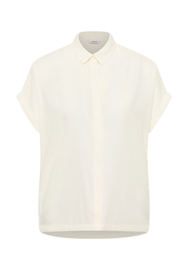 Short-sleeve, collared shirt in light cream fabric. Features a front button closure, straight cut hem, and subtle logo in matching color.