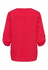 Czerwona, lekka koszula o fakturowanym wykończeniu. Posiada rękawy do łokcia i prosty dół. Widok z tyłu ukazuje prosty, klasyczny design.