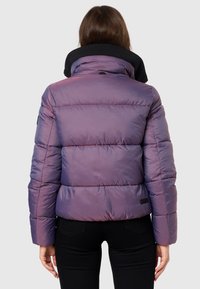 Puffer jacket in iridescent purple with a black collar. Features a quilted design, a fitted silhouette, and a small brand label on the back.