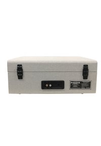 Graue, mit Stoff überzogene Box mit zwei schwarzen Verschlüssen, Audio-Eingangs-/Ausgangsports auf der Rückseite und einem Warnlabel auf einer schwarzen Platte.