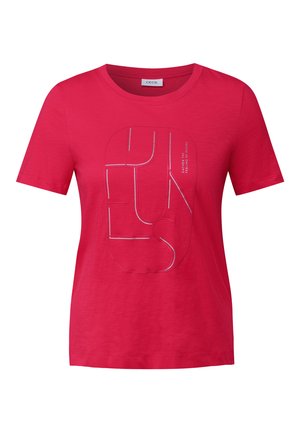 T-shirt in cotone rosa con un design grafico con contorni bianchi e testo. Maniche corte, scollo rotondo e vestibilità rilassata.