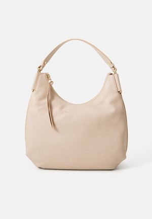 Beige leather hobo bag with a textured finish, a curved top, and a single strap. Features a zip closure and a decorative tassel detail.
