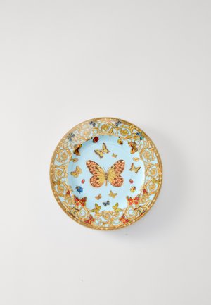 Modri porcelanasti krožnik z zlato cvetlično borduro, v sredini pa so različni barviti metulji in insekti. Sijajna površina z izpopolnjenim dizajnom.