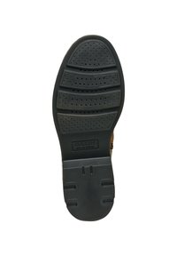 Suela de zapato de goma negra con superficie texturizada, que presenta surcos y perforaciones para la transpirabilidad. Marcada con "GEOX PATENTE ITALIANA."