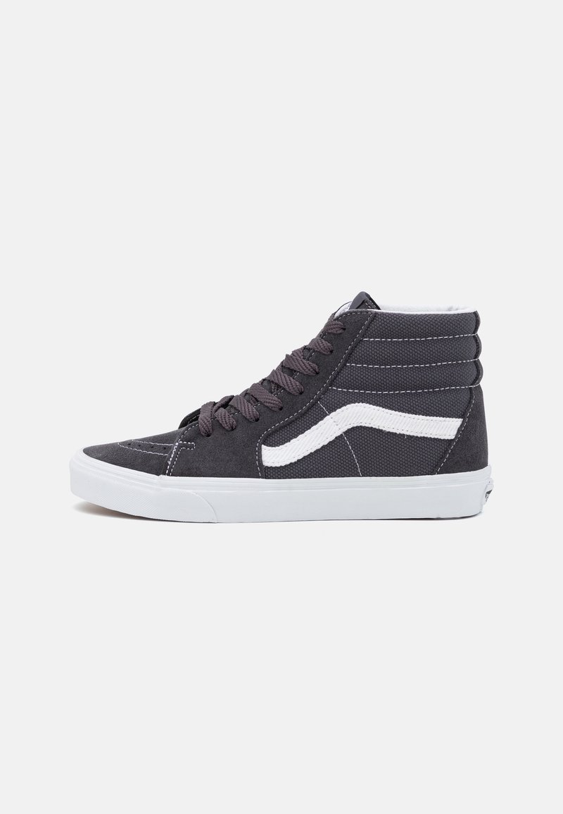 High-top black and white sneaker with white rubber sole, black laces, and distinctive white side stripe on plain light background.