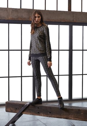 ALLOVER LOGO - Leggings - Trousers - fancy black/white