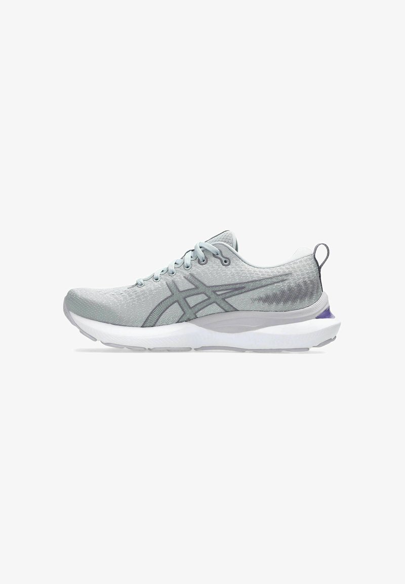 Light gray running shoe with a textured mesh upper, white midsole, and purple accent on the heel. Features lace-up design and padded collar.