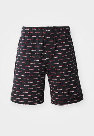 Black shorts with an elastic waistband, featuring a repeated red and white "HUGO" logo pattern throughout. Made from smooth fabric.