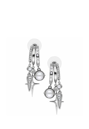 Silver hoop earrings with clear crystals, pearls, planet-shaped charms, and starburst pendants on transparent studs.
