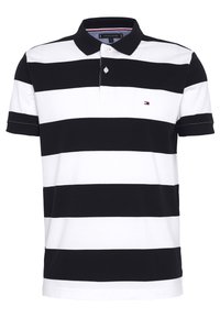 Polo rayé noir et blanc en coton. Doté d'un col, de manches courtes et d'un petit logo sur la poitrine. Design classique.