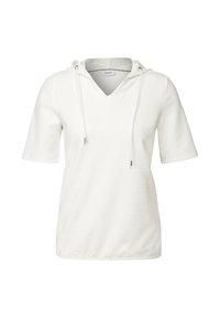 Haut à manches courtes blanc avec un col en V, fabriqué en tissu texturé. Dispose d'une capuche et de cordons avec des embouts en métal.
