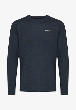 Tumedast tumesinisest sinisest pehme kangast pikakäised särk, millel on peen tekstuur ja väike valge logo vasakul rinnal.