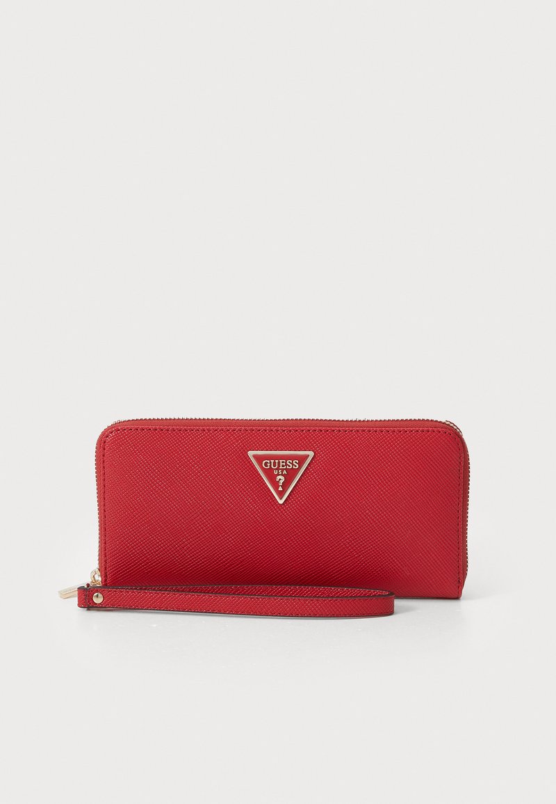 Red, textured synthetic wallet with a zip closure, wrist strap, and a triangular metal logo accent. Compact and rectangular shape.
