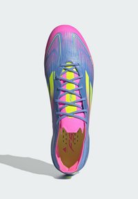 Lightweight soccer cleat with a blue and pink gradient upper, yellow accents, and textured design. Features lace-up closure and rounded toe.