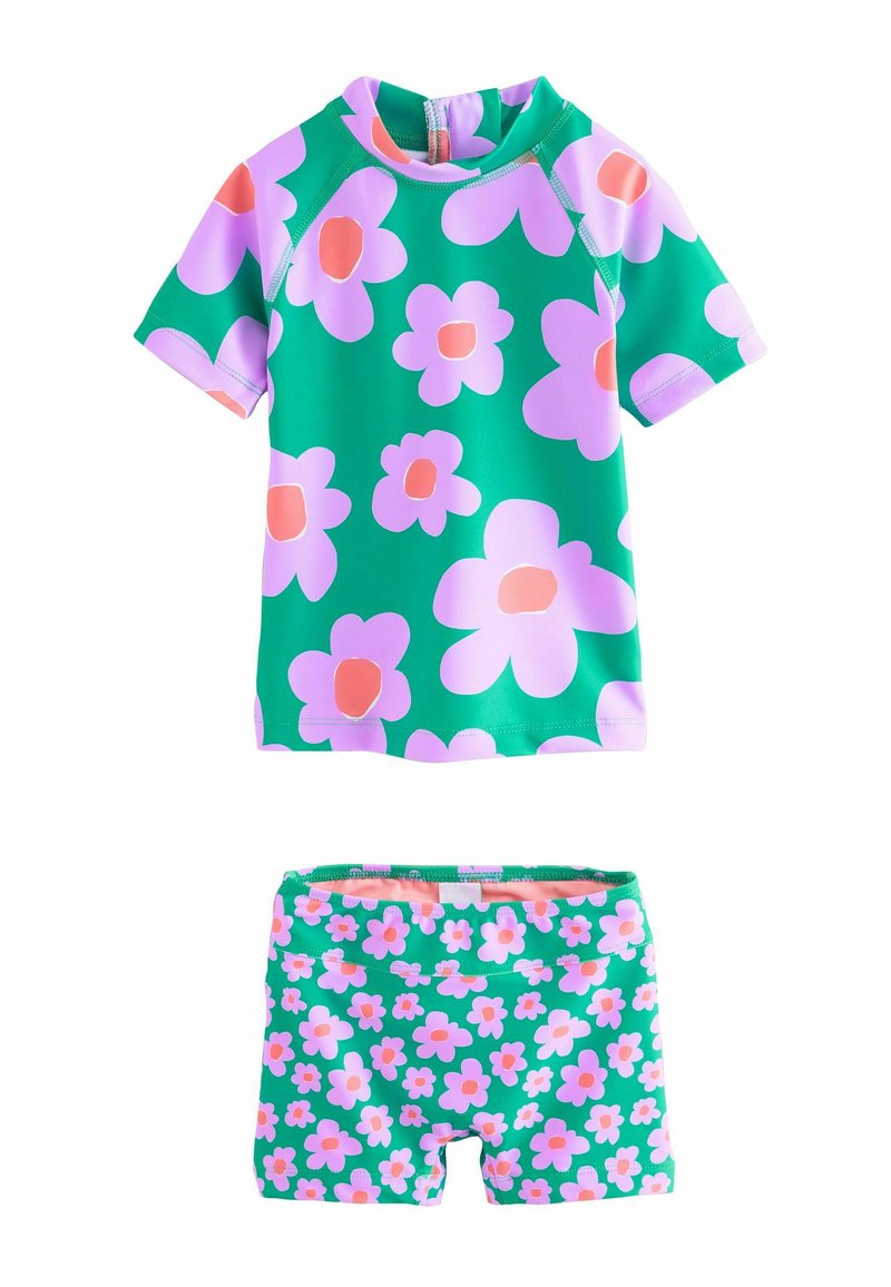 Kortsleeve rash guard och shorts set i grönt med stora rosa blommor. Tillverkat av elastiskt material, har en dragkedja och resårmidja.