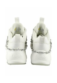 White sneakers with textured fabric, rubber soles, and silver chain accents. Features a logo and pull tabs on the heels.