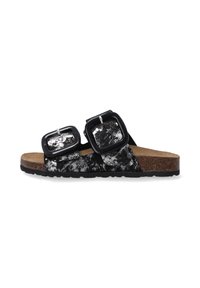 Zwart-wit patroon slide sandalen met twee grote vierkante sluitingen op een kurken zool. Getextureerde bovenkant en rubberen loopzool.