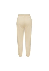 Beżowe dresy z elastycznym pasem i elastycznymi mankietami. Wykonane z miękkiego materiału bawełnianego, charakteryzujące się gładką fakturą i prostym designem.