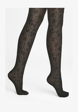 Czarne rajstopy w kwiatowy wzór, półprzezroczysta tekstura i delikatne wykończenie. Posiadają nieprzerwaną gładką górną część.