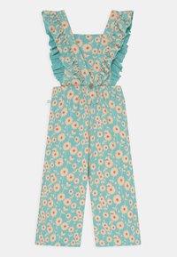 Tealfarbene Latzhose mit floralem Druck, Rüschen an den Schulterträgern und Knopfdetails. Zeigt pinke Blumen auf einem hellgrünen Hintergrund.