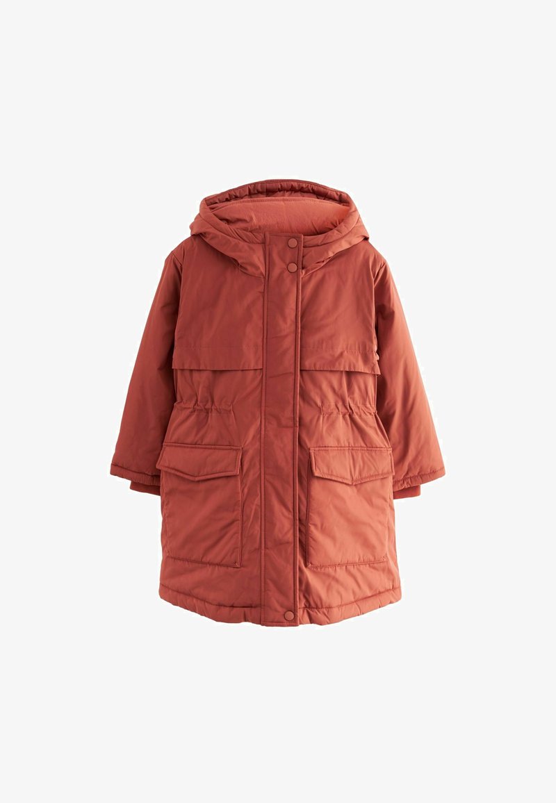 Podložena, kapucojaka v rjavi barvi, ki ima dva velika sprednja žepa in zapiranje na zatiče, s ravnim krojem in mehkobo materiala.