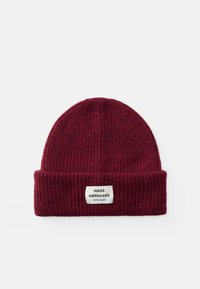 Gorro de malha bordeaux feito de lã texturizada com um punho dobrado. Apresenta um rótulo cosido com texto preto.