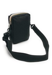 Svart nylon crossover bag med rektangulær form, som har glidelåslukking, justerbar stropp og en jevn tekstur. Pyntet med multicolorer glidelås.