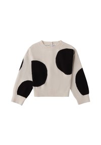 Maglione crema con ampie toppe nere circolari, scollatura rotonda, orlo e polsini a coste, texture morbida, design cropped.